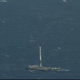 The first stage of the Falcon 9 rocket sits on its landing ship.